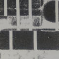 Detail of an abstract print in black and white of an irregular rectangular pattern.